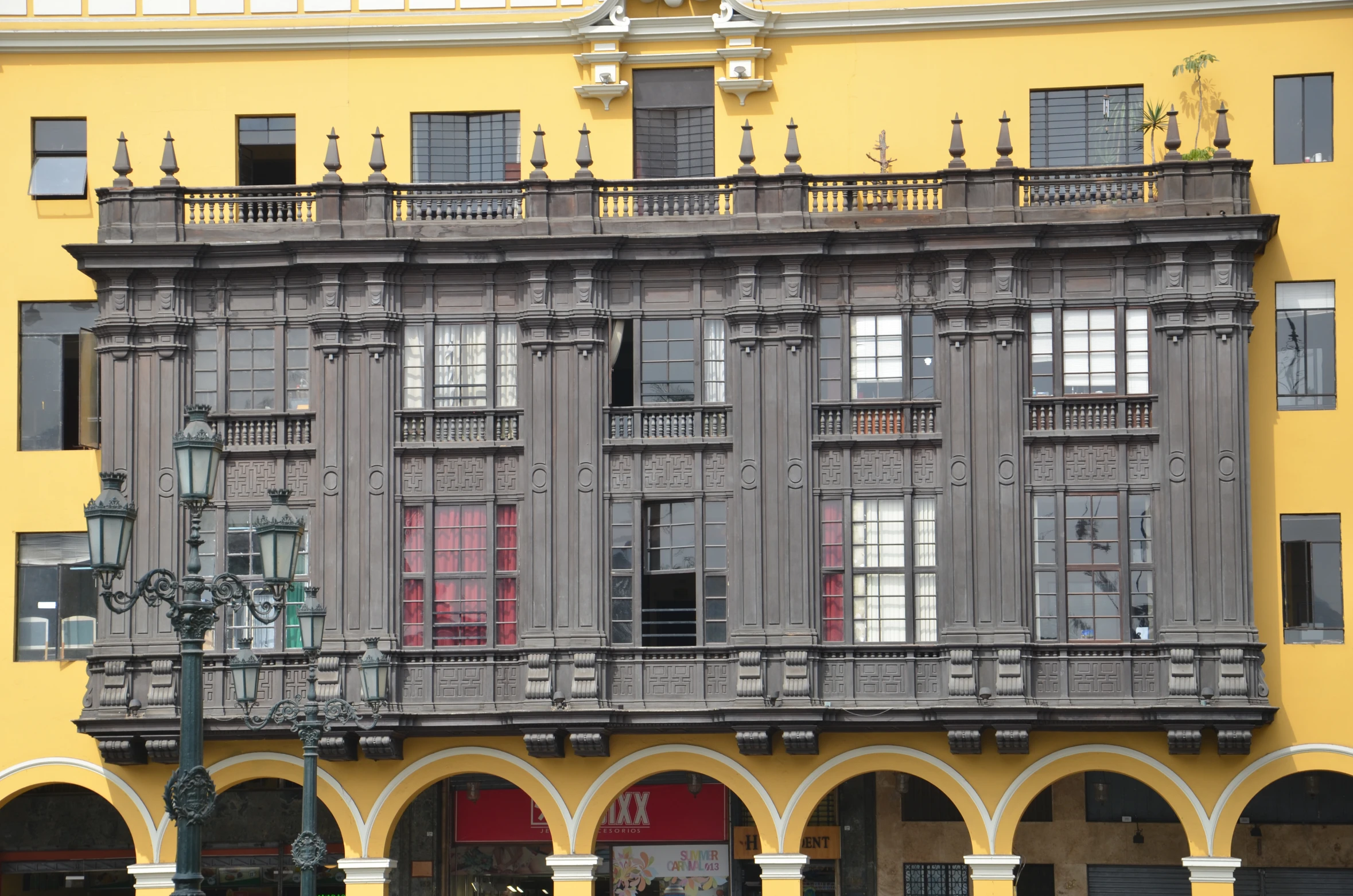 the facade of a building with arches and balconies