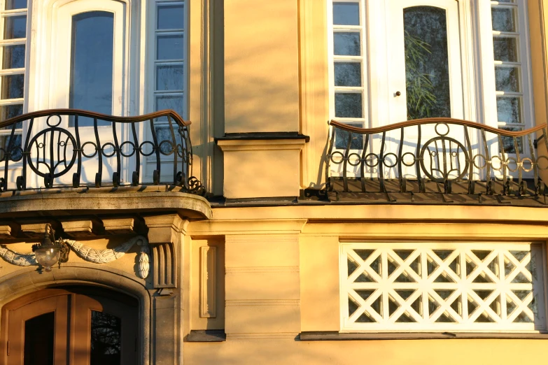 an old apartment building has balcony iron bars