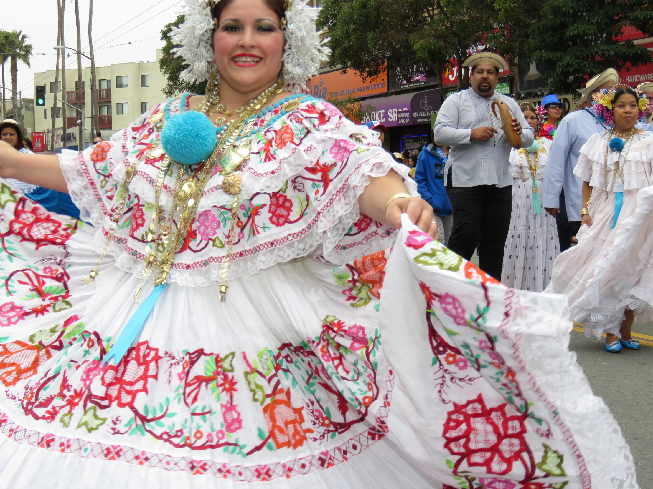 several women dressed in colorful clothing at a parade