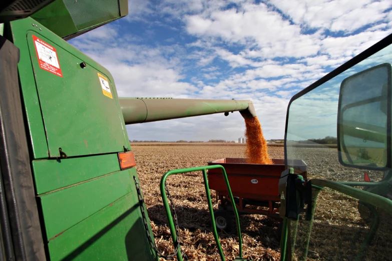 a tractor with a grain tank on it and a tractor handle in front