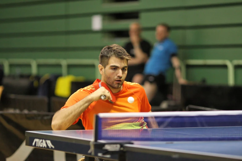 a man is getting ready to play table tennis