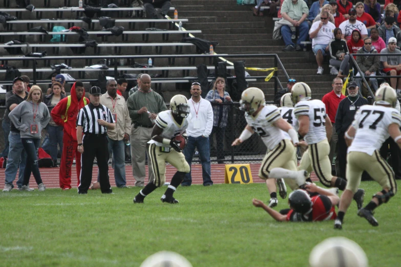 the football team is running for the ball in the field