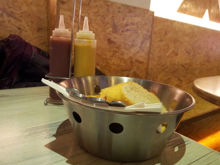 a metal pan filled with slices of cake on top of a table