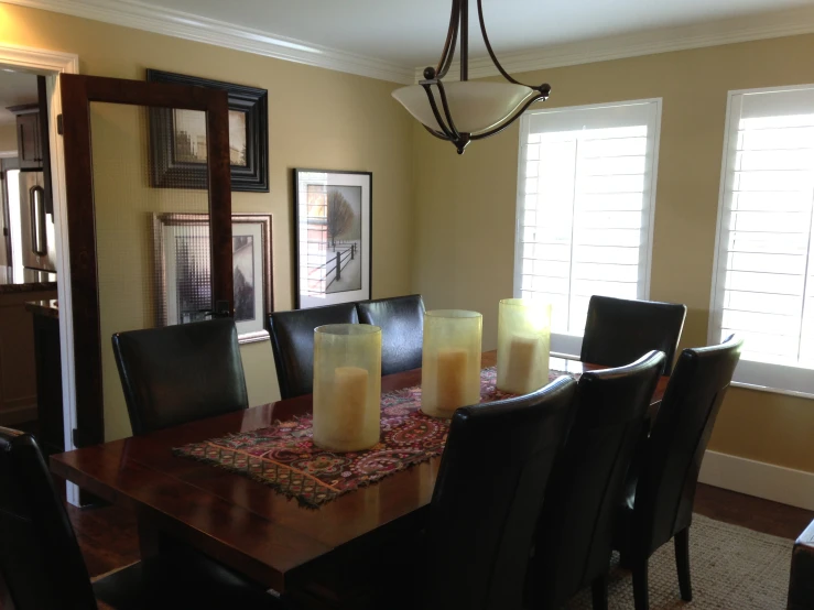 the dining room is set with candles for dinner