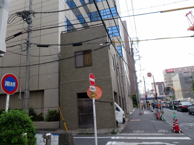 a street with traffic signs and building next to it