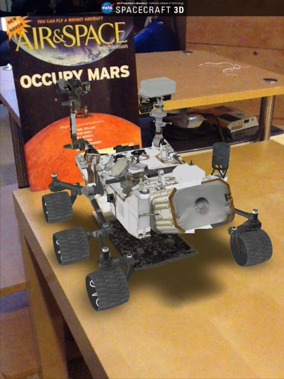 a toy astronaut's space shuttle set on a desk