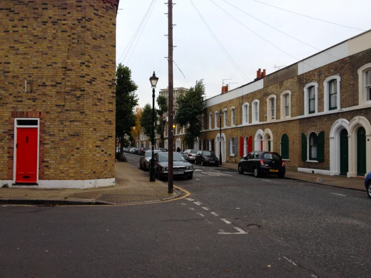 the street in front of two large brick buildings