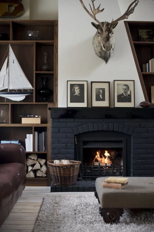 a living room with two chairs and a fire place