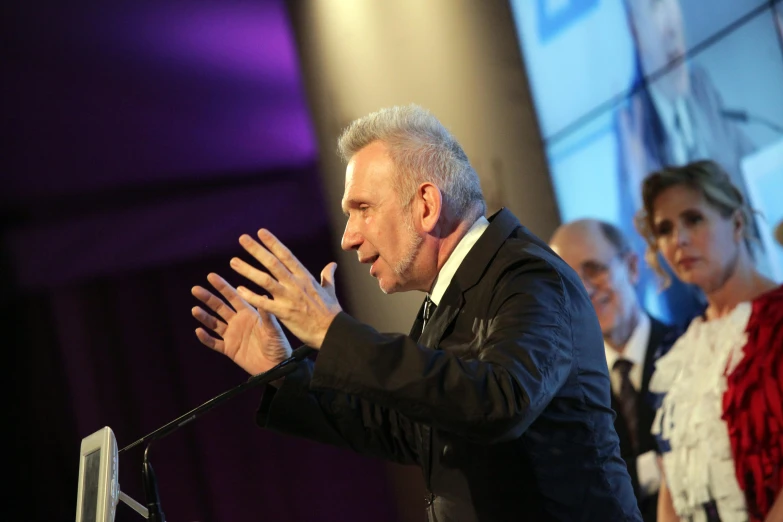 an image of a man at the podium giving a speech