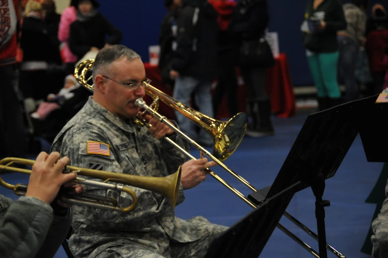 a man in military uniform playing the trumpet