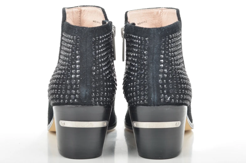 black high - top spikes boots with a metallic metal trim