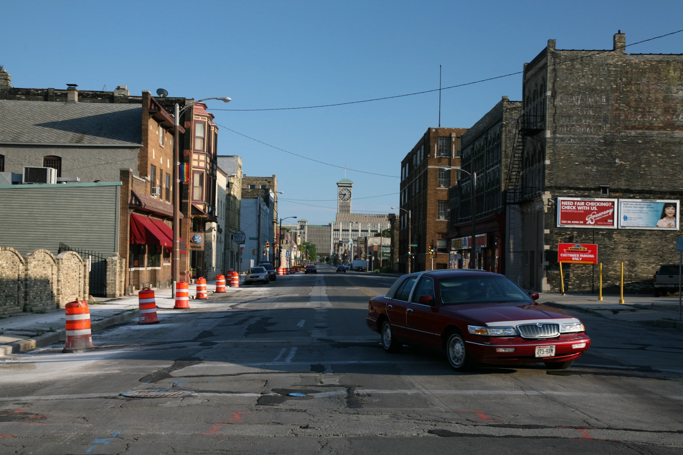 a car driving down the road that is under construction