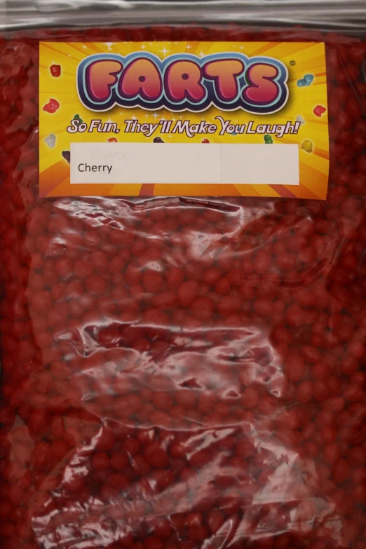 a bag of raspberries sitting on top of a table