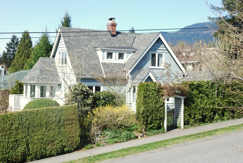 an old house with vines around the top