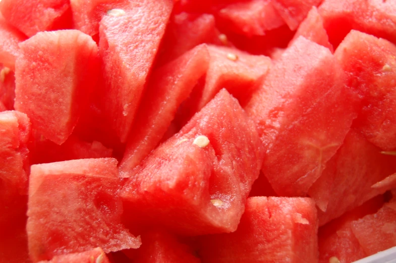 a close up of sliced pieces of watermelon