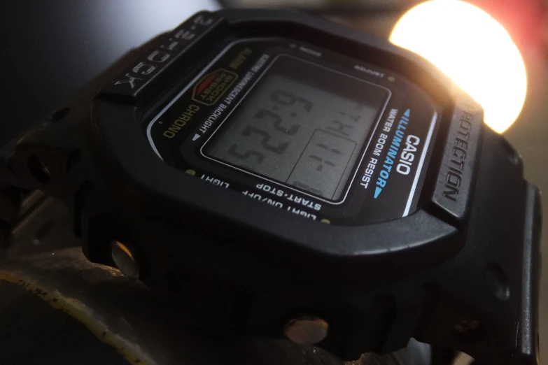 a digital stopwatch in a bicycle frame with lights behind