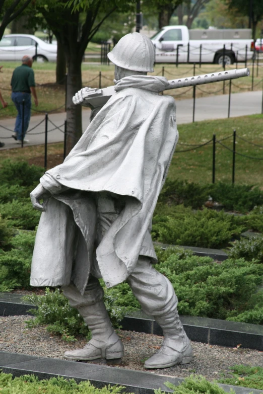 a statue is shown with a sword and a robe