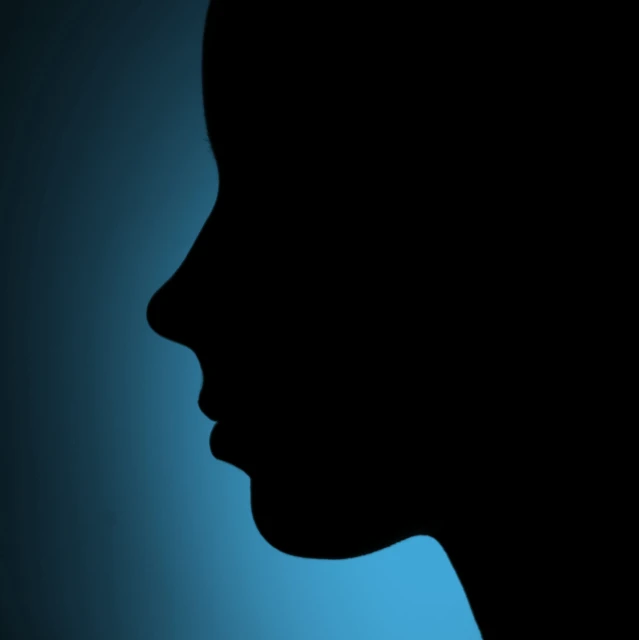 the silhouette of a woman's head in profile