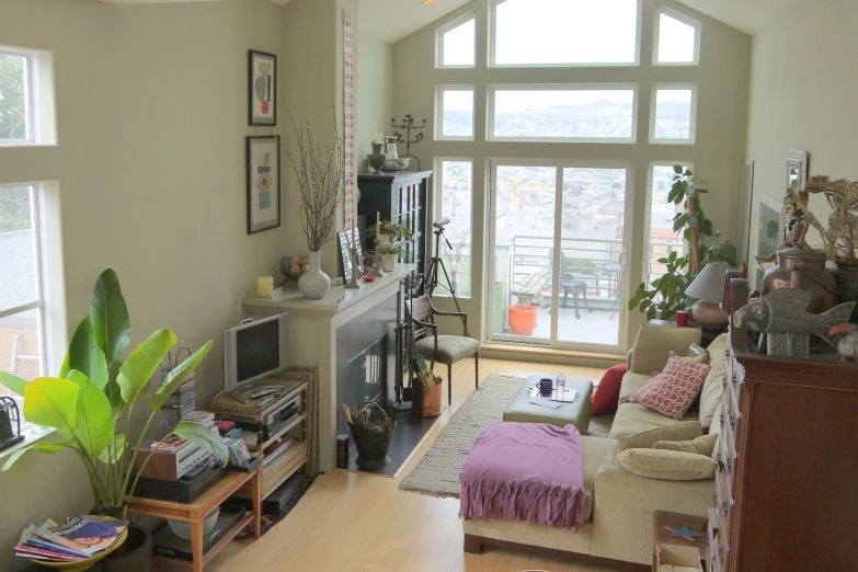 a living room filled with furniture and a fire place