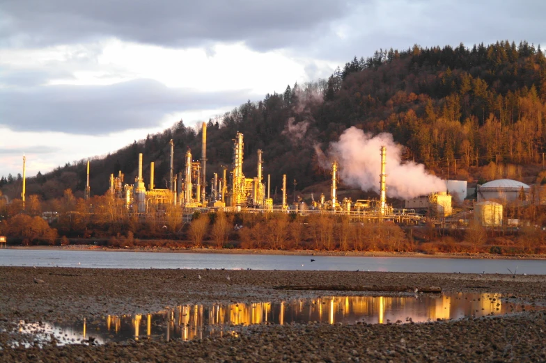 industrial landscape overlooking large mountain in the evening