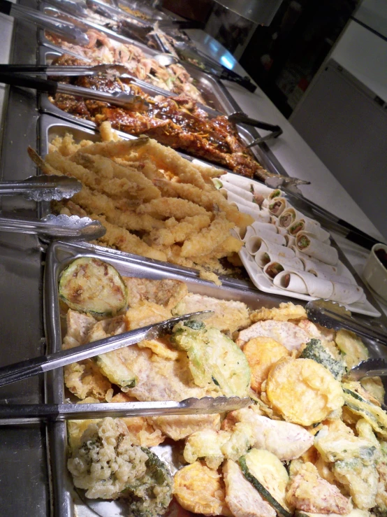 long row of different types of food on a counter