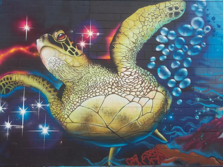 a large painting of a green turtle under water