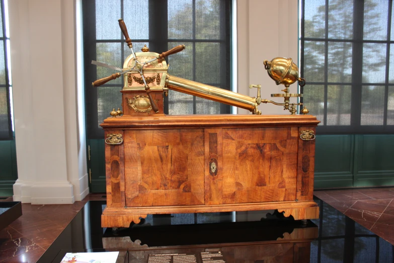 a statue of a wooden structure with a clock on it