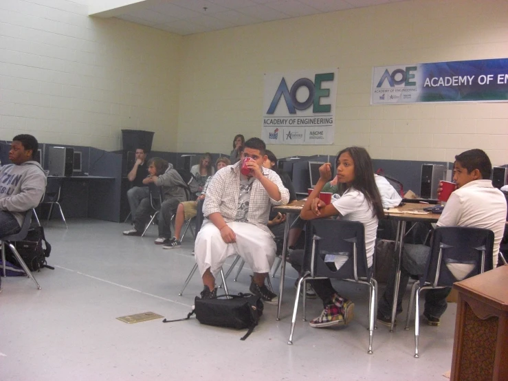 a group of people sitting on the floor in a room