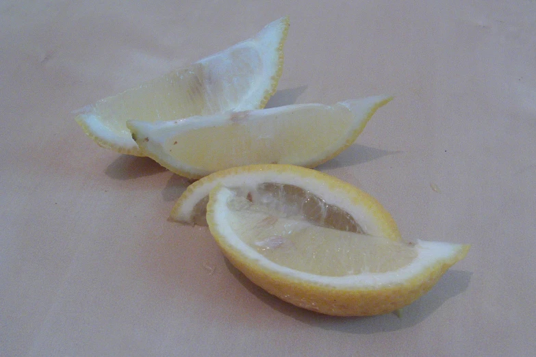 an orange sliced in half with one slice removed from the orange
