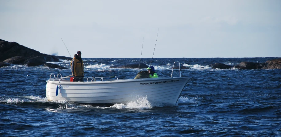 a group of people on a boat in the ocean