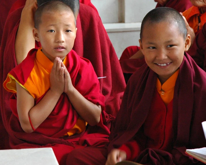 some young monks are doing crafts together
