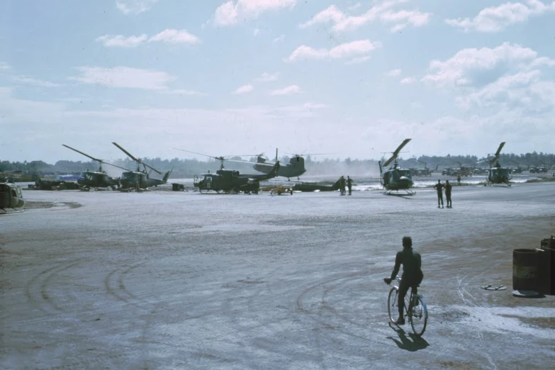 a person on a bike, and several planes are in the background