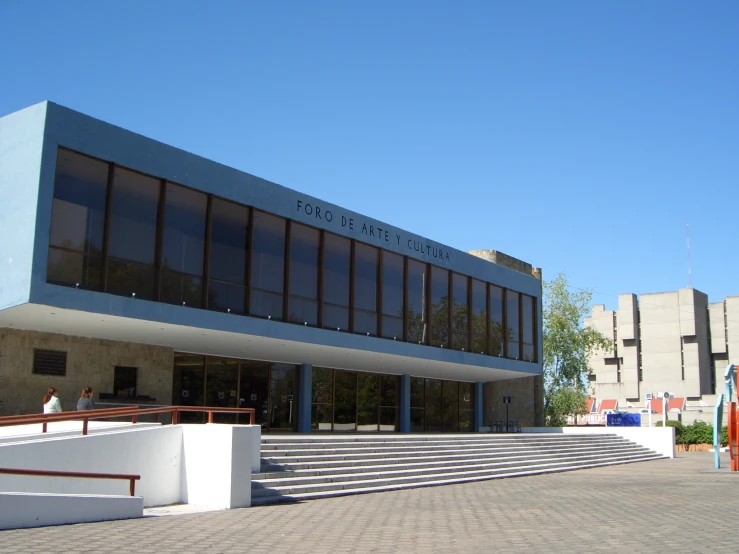 a large gray building with many windows on it