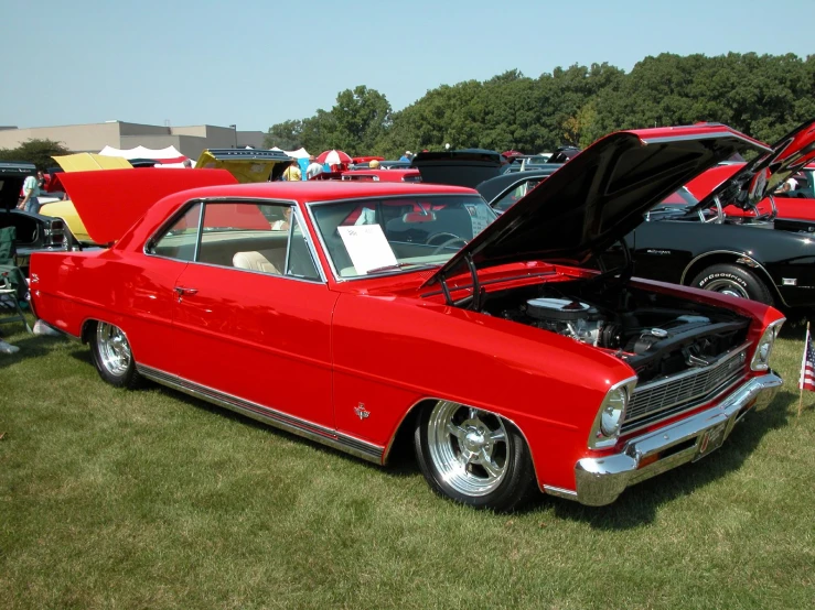 old cars are parked on display at an auto show