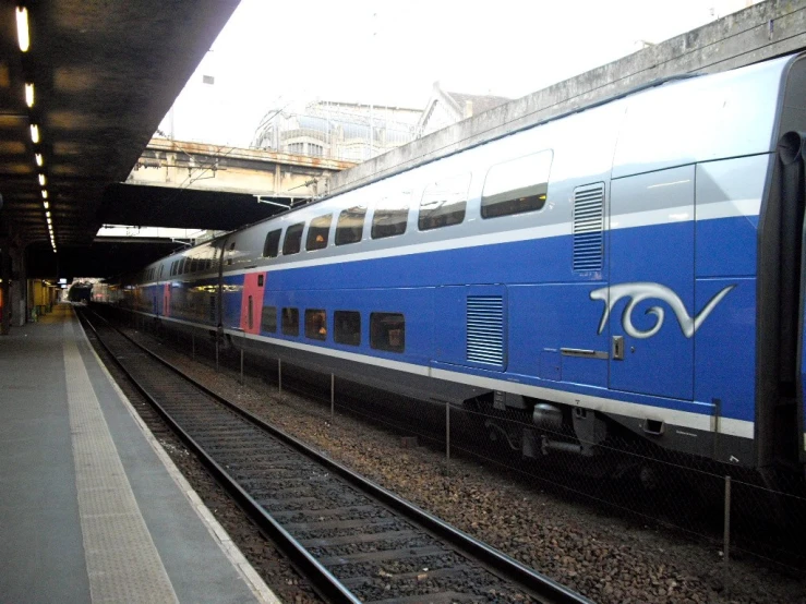 a train is sitting parked on the tracks