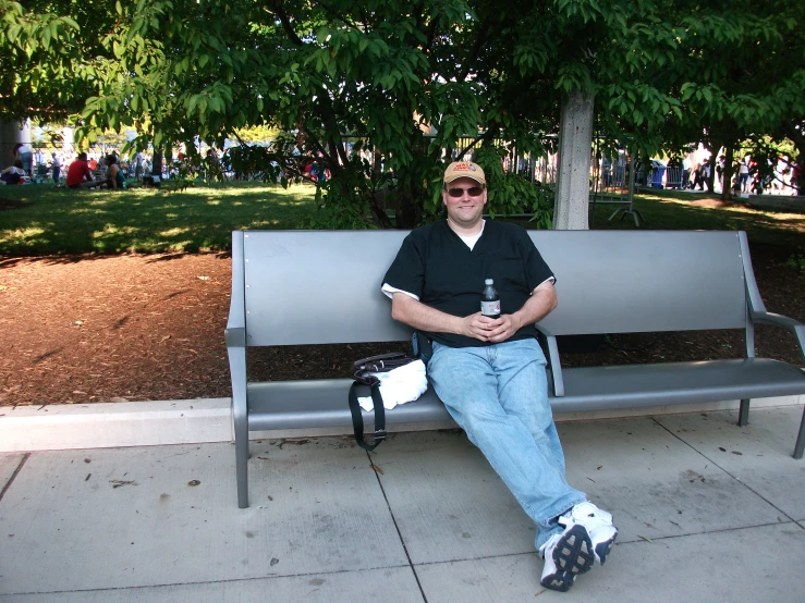 a person sitting on a bench with an object