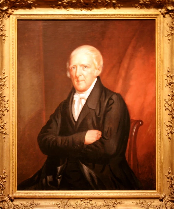 an old man wearing a suit and tie poses for a portrait