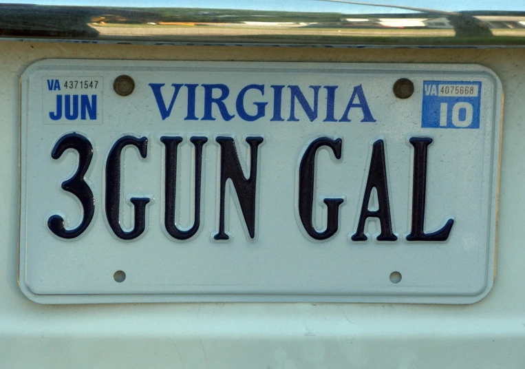 a license plate with words written underneath it