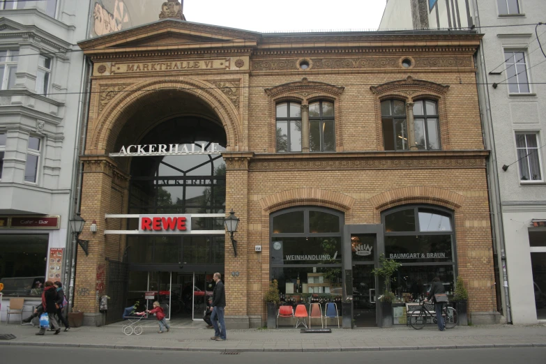 an old brown brick building with a clock on it