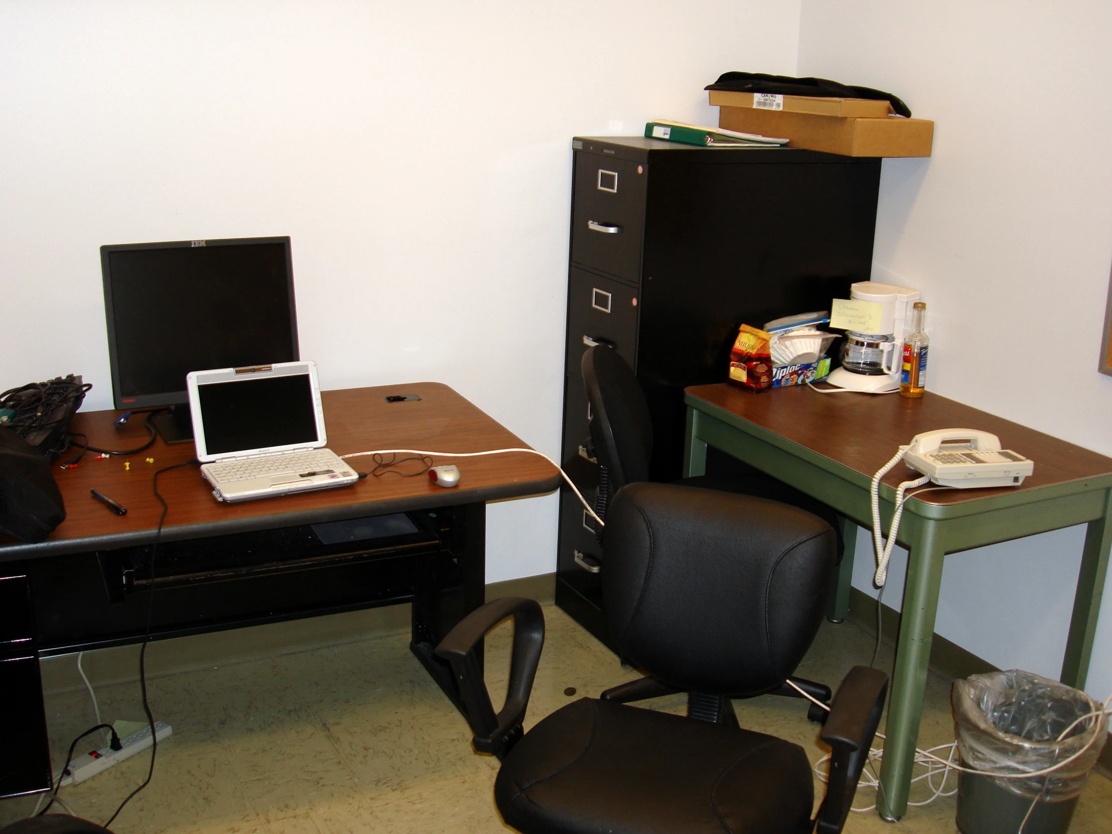 a work area with a computer and a chair