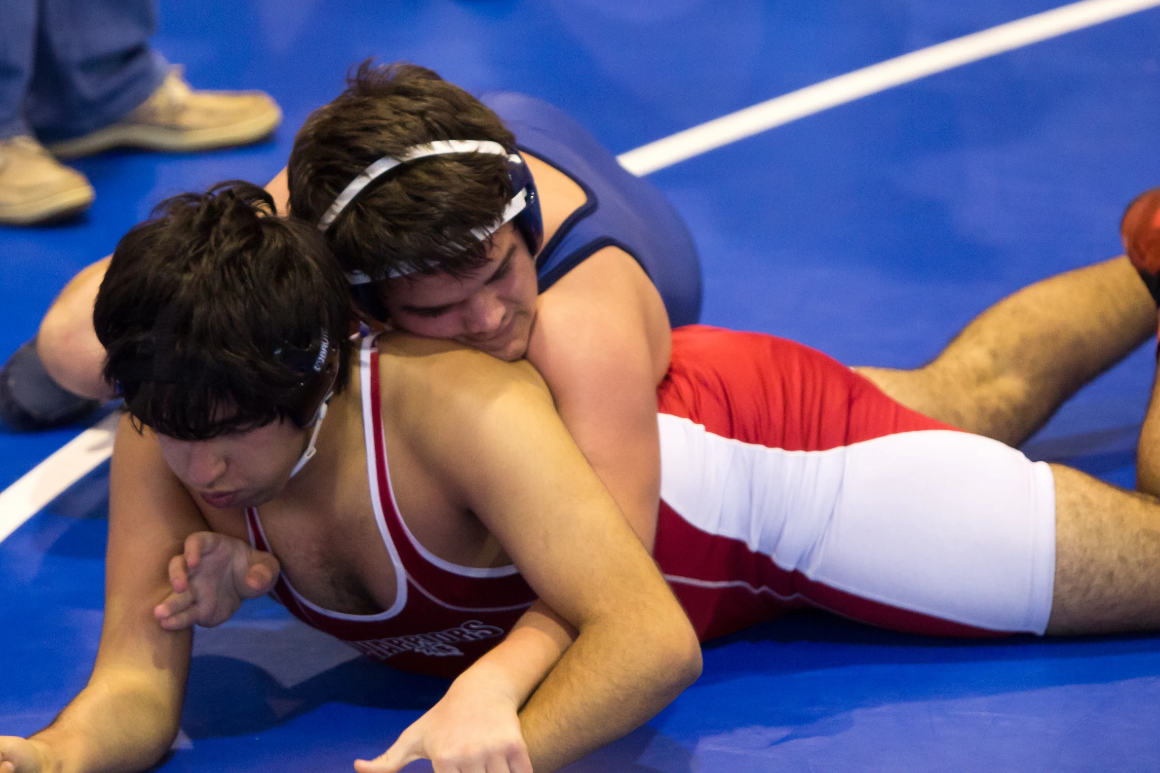 a couple of people are wrestling on the ground