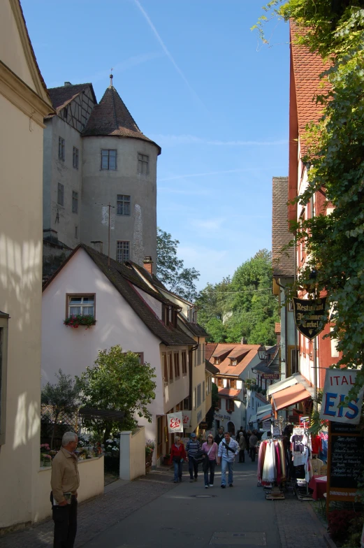 an empty street filled with people walking through it