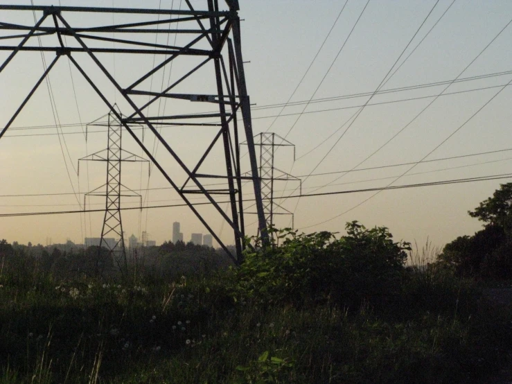 electrical power lines over the skyline at dusk