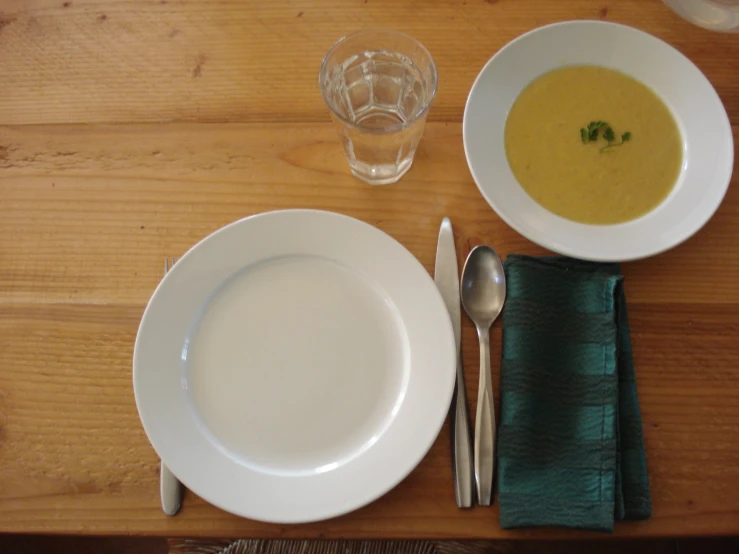 a meal consisting of soup and bread is presented
