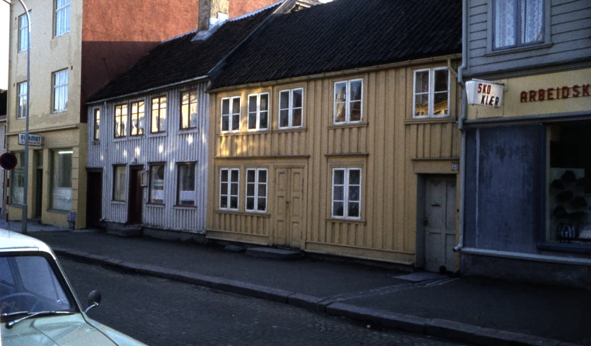 some brown buildings white and blue buildings and a light