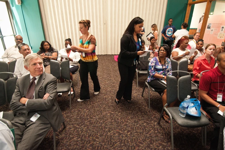 several people are in the waiting room at an event