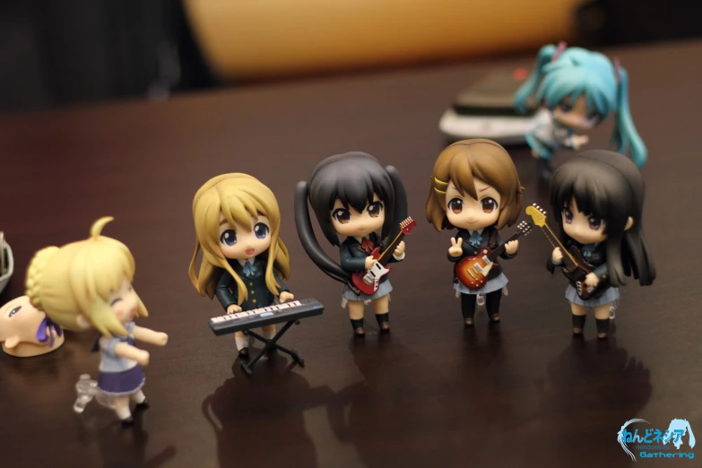 some miniature figurines are sitting on a table