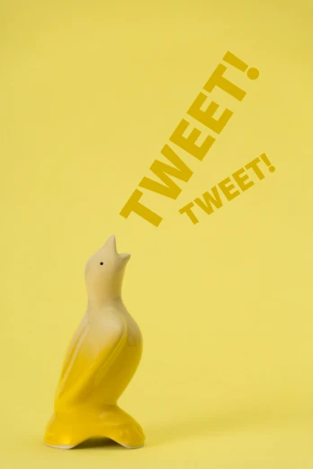 a yellow and white porcelain figurine with a worded tweet on the front of it
