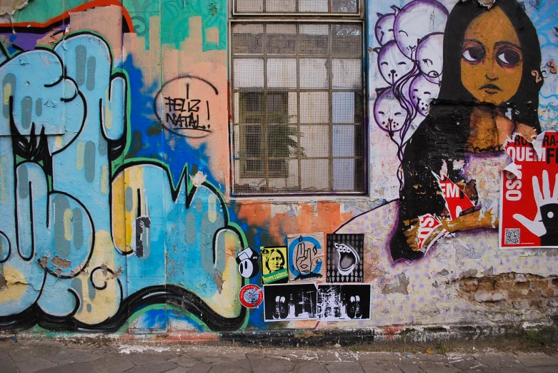 a wall covered in lots of colorful graffiti