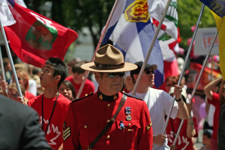 a parade of soldiers with flags and flags